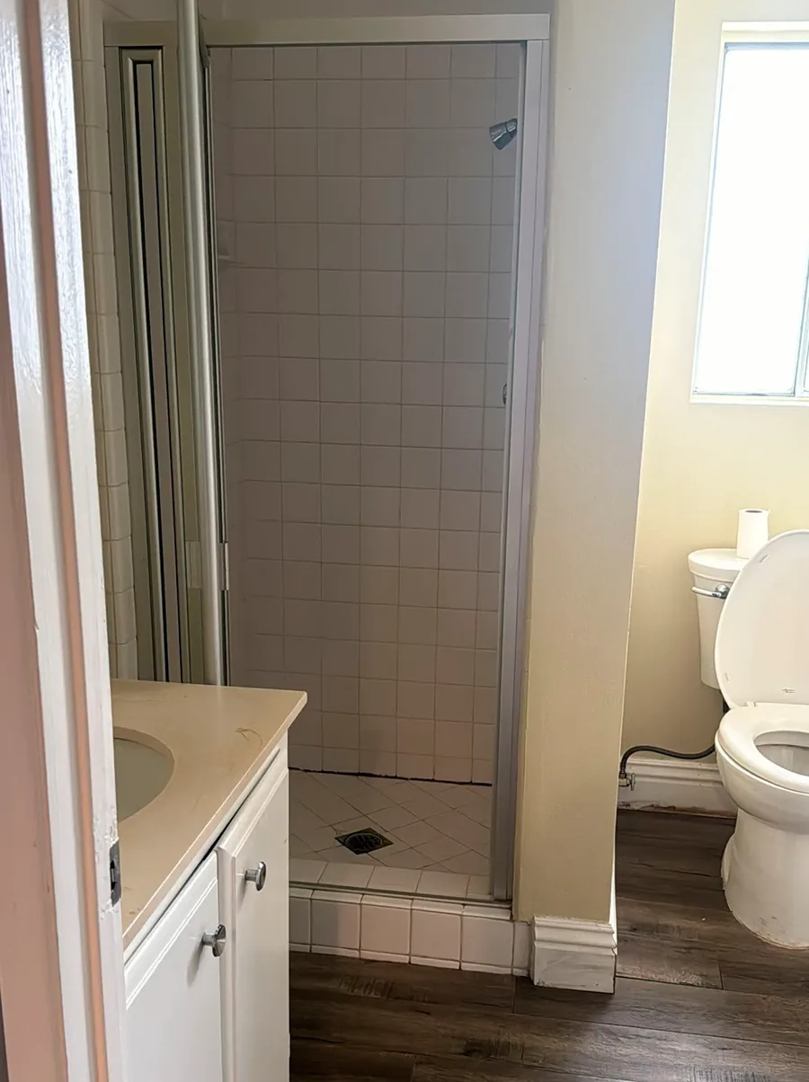 Guest Bath — Marble Tile & Glass Shower before